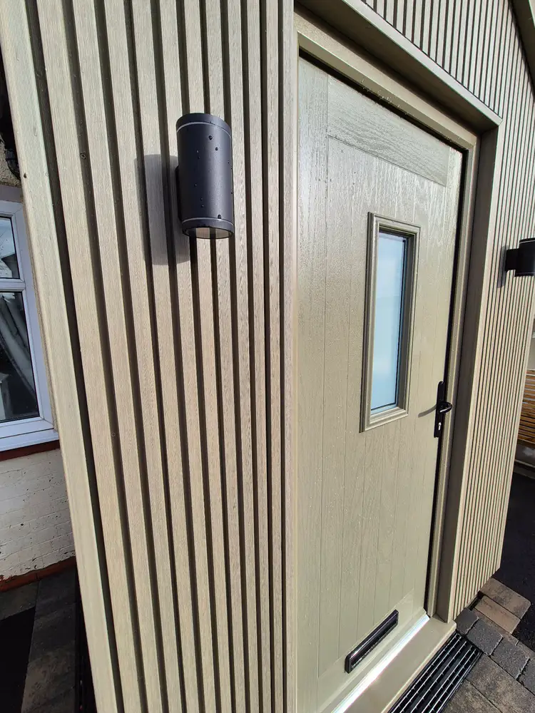 Close-up of external cladding and a door from a client project